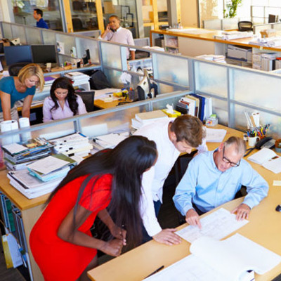 Office workers discussing Group Health Insurance in White Plains, Lake Success, NY, Melville, NY, and Nearby Cities